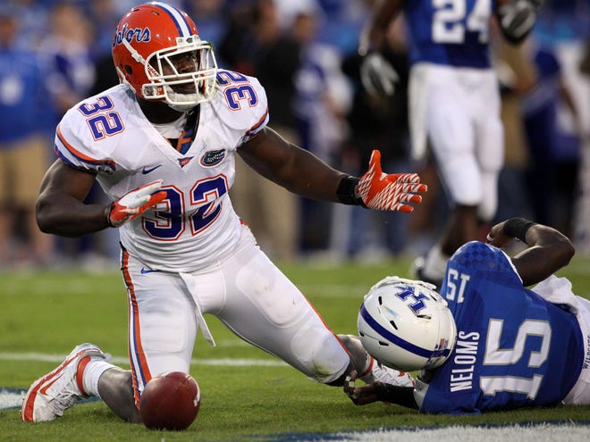 Florida's Gerald Christian makes the catch and the touchdown during the first half against Kentucky at Commonwealth Stadium in Lexington, Ky. in this September 24, 2011 file photo.