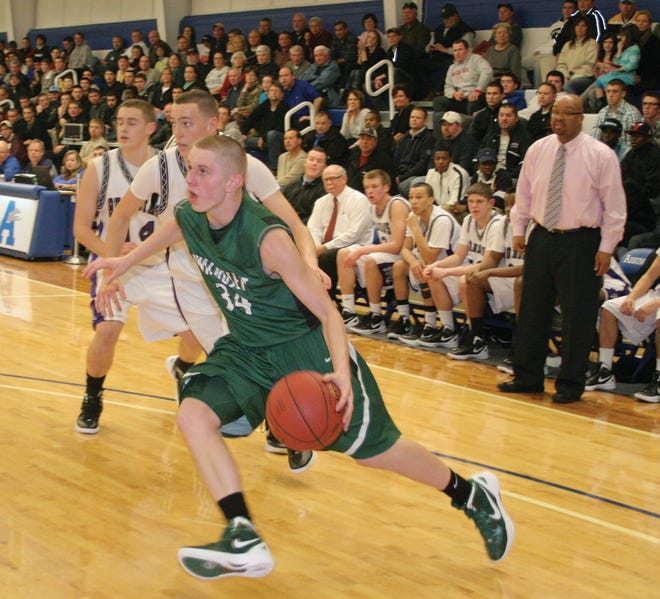 Jesse Maresca, a junior guard for Wachusett, drives against St. Peter-Marian in the title game of the Laska Tournament. The Guardians won the tourney for the first time, 50-47.