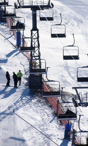Massachusetts Public Safety inspectors survey the Ward Hill ski lift area in Shrewsbury after an 18 year old died after falling last night.
