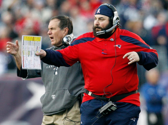 Patriots head coach Bill Belichick, left, and safeties coach Matt Patricia react on the sidelines during last Sunday's game against the Bills at Gillette Stadium in Foxboro. The Patriots won 49-21 to clinch the number one seed in the AFC.