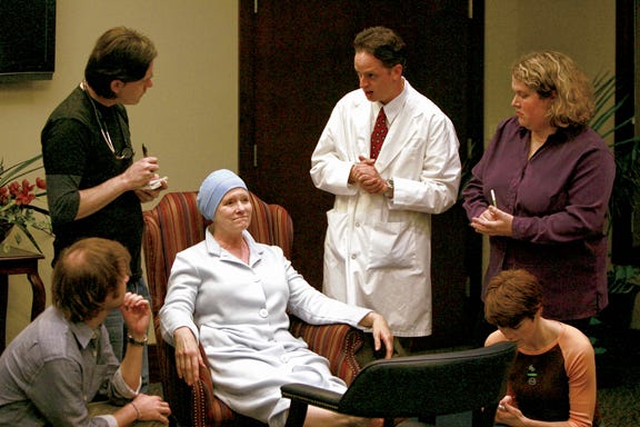 From left, Benjamin Cady (crouching), Patrick Russell, Leigh Steiner, Jeff Nevins, Erin Rachford and Aasne Vigesaa (crouching) rehearse a scene from “Wit” in 2008.