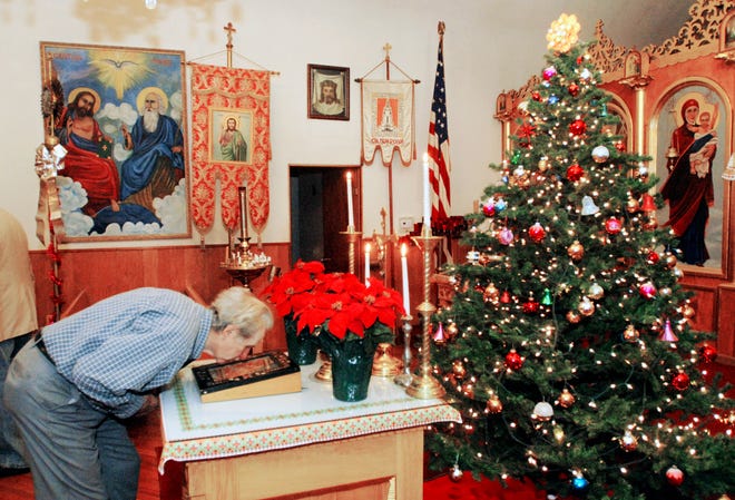 Wasyl Hula, of Richfield, kisses an image of an icon after the Christmas Eve service at St Mary's Ukrainian Orthodox Church Friday January 6, 2012 in Herkimer, NY.