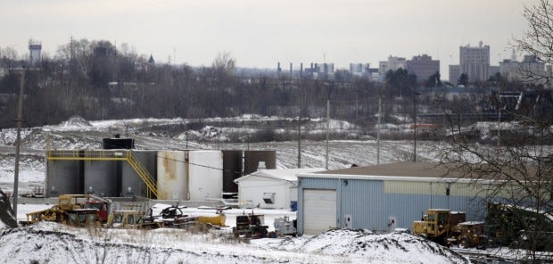 A brine injection well owned by Northstar Disposal Services LLC
is seen Wednesday with the skyline of Youngstown in the distance.
The company has halted operations at the well, which disposes of
brine used in gas and oil drilling, after a series of small
earthquakes hit the Youngstown area.