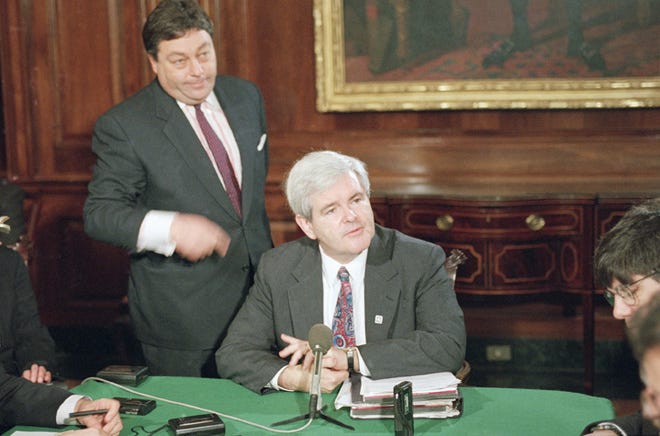 In this March 7, 1995, file photo, House Speaker Newt Gingrich, center, and his press secretary, Tony Blankley, left, meet with reporters during a daily Capitol Hill news conference. Blankley, a conservative author and commentator who served as press secretary to Newt Gingrich during the 1990s, when Republicans took control of Congress, died Sunday, Jan. 8, 2012. He was 63. (AP Photo/Joe Marquette, File)