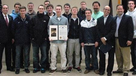 The YMS Thunder soccer team displays a citation from State Rep.
Steven J. Santarsiero in honor of its 2011 national
championship.