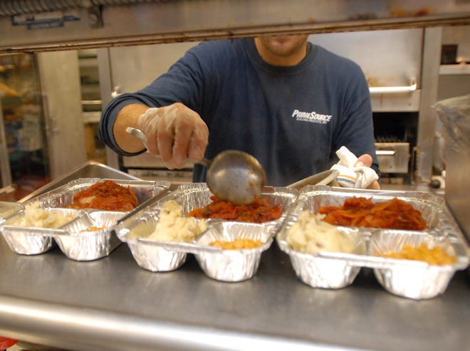 Ryan Bladek, a sous chef at Knights Inn, prepares food for Meals on Wheels, January 06, 2012, in Little Falls, NY.