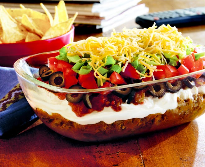 This 7-layer taco dip uses sausage with delectable results.