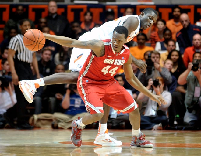 Ohio State's William Buford (44) reaches for the ball next to Illinois' Nnanna Egwu looks on during the first half of an NCAA college basketball game in Champaign, Ill., on Tuesday, Jan. 10, 2012.