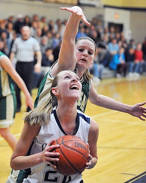 Coyle-Cassidy's Tricia Quinn looks for the hoop as Bishop Feehan's Sierra Schrader defends during Tuesday's game.