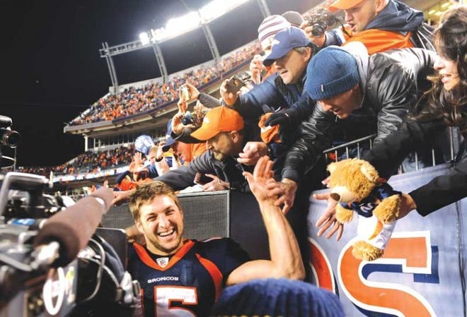 Quarterback Tim Tebow celebrates with fans in Denver after the
Broncos beat the Pittsburgh Steelers 29-23 in overtime Sunday.