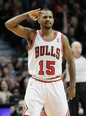 Chicago Bulls' John Lucas III (15) reacts after hitting a 3-point shot during the fourth quarter of an NBA basketball game against the Washington Wizards in Chicago on Wednesday, Jan. 11, 2012. The Bulls won 78-64.