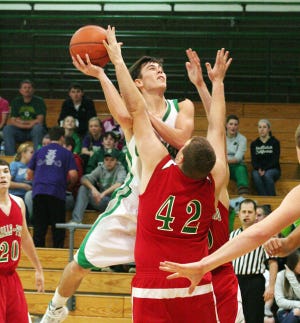 Alec Cheek drives the lane and scores two points over the LaSalle-Peru defenders Jan. 10 in Geneseo.