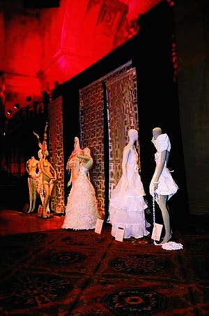 Kathy C. Vang's garment on display at the PAVE Gala in New York. Her design is second from the right. The entire dress is made from paper, papier mâché, beads and other recycled elements.