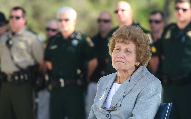 Brenda Parker, widow of murdered St. Augustine Beach Deputy Marshal Ron Parker, listens to a speaker during a ceremony marking the 37th anniversary of her husband's death on Thursday, January 12, 2012. By PETER WILLOTT, peter.willott@staugustine.com