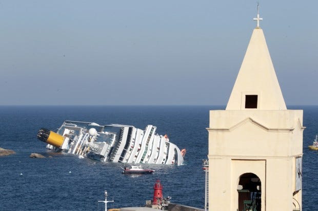 The luxury cruise ship Costa Concordia leans on its starboard
side after running aground Saturday off the port at Giglio, on the
tiny Tuscan island of Giglio, Italy.