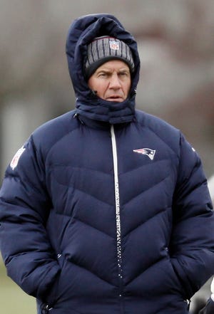 New England Patriots head coach Bill Belichick watches practice at the NFL football team's facility in Foxborough, Mass. Wednesday, Dec. 28, 2011. (AP Photo/Winslow Townson)