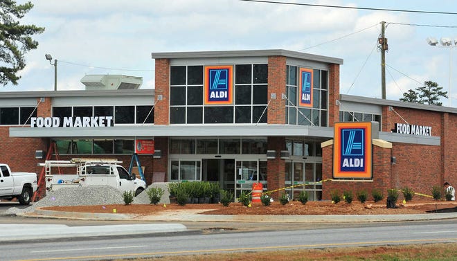 Richard Hamm/Staff Construction continues as workers finish the new Aldi Food Market on Atlanta Highway on Thursday, Jan. 12, 2012 in Athens, Ga.