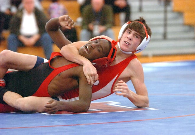 Bridgewater-Raynham's Stephen Pace, right, of Bridgewater, defeats Brockton's Watna Cunha in the 103-pound class on a pin.on Wednesday, Jan. 5, 2011.