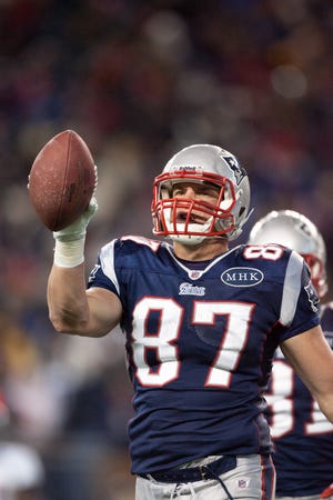 Patriots tight end Rob Gronkowski celebrates a touchdown in the first half of Saturday's AFC Divisional game between the New England Patriots and the Denver Broncos on Saturday, Jan. 14, 2012.