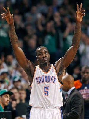 Thunder center Kendrick Perkins acknowledges fans' applause in the first quarter of last night's game, his first in Boston since the Celtics traded him last season.