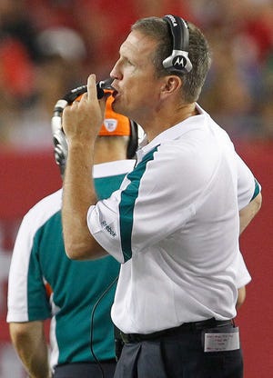 FILE - in this Aug. 27, 2011, file phot, Miami Dolphins defensive coordinator Mike Nolan calls a play from the sidelines during a preseason NFL football game against the Tampa Bay Buccaneers in Tampa, Fla. The Atlanta Falcons have hired Nolan as their defensive coordinator, on Tuesday, Jan. 17, 2012. Nolan spent the last two seasons as Miami's defensive coordinator. Prior to that, he served four years as the San Francisco 49ers' head coach. (AP Photo/Margaret Bowles, File)