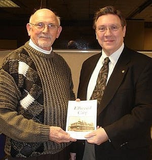 Everett Bleakney, left, author of a newly published book on
Ellwood City postcards, was a guest of the Ellwood City Rotary Club
during its meeting Jan. 5. Welcoming Bleakney was the Rev. Jim
Latta, club president.