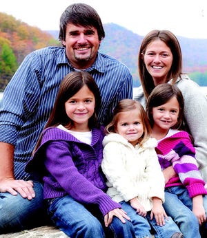 Justin and Bethany Grove with their daughters. As a self-employed contractor, Justin is not working while he battles a rare form of cancer.