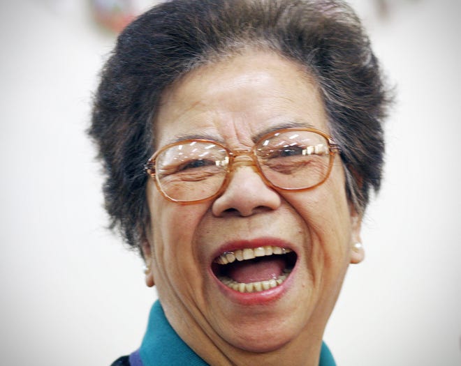 Choi Ha Ng takes part in laughter yoga at the Wollaston Senior Center.