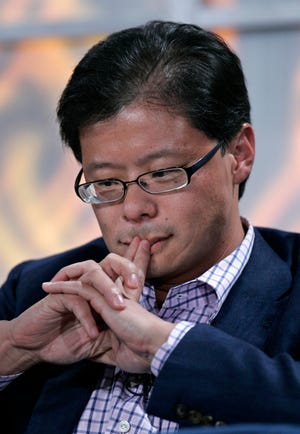 FILE- In this Nov. 5, 2008 file photo, Yahoo CEO Jerry Yang ponders a question during a talk at the Web 2.0 Summit in San Francisco. Yang announced Tuesday, Jan. 17, 2012, that he is leaving Yahoo. The surprise departure comes just two weeks after Yahoo Inc. hired former PayPal executive Scott Thomson as its CEO. Yang expressed his support of Thompson in his resignation from Yahoo's board of directors. He had been on Yahoo's board since the company's 1995 inception. (AP Photo/Paul Sakuma, File)