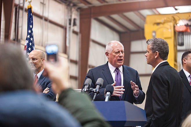 Illinois Gov. Pat Quinn speaks with Excel Foundry and Machine, Inc. President and CEO Doug Parsons Tuesday after the announcement of a $15 million expansion and the opening of 100 more jobs at the facility.
