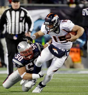New England Patriots outside linebacker Rob Ninkovich (50) takes down Denver Broncos quarterback Tim Tebow (15) during the second half of an NFL divisional playoff football game Saturday, Jan. 14, 2012, in Foxborough, Mass. (AP Photo/Stephan Savoia)
