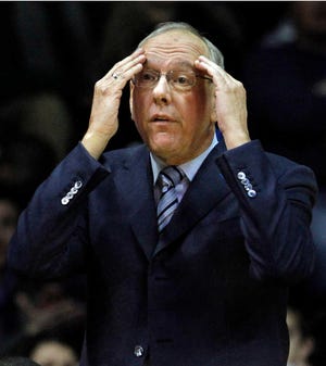 FILE - In this Jan. 1, 2012 file photo, Syracuse head coach Jim Boeheim reacts during the first half of a college basketball game against DePaul, in Rosemont, Ill. These have been some of the most difficult days in Boeheim's life. But the Syracuse coach has kept his focus on basketball. (AP Photo/John Smierciak, File)