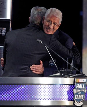 Glen Wood, right, embraces his brother, Leonard, left, after being inducted into the NASCAR Hall of Fame in Charlotte, N.C., Friday, Jan. 20, 2012. (AP Photo/Chuck Burton)