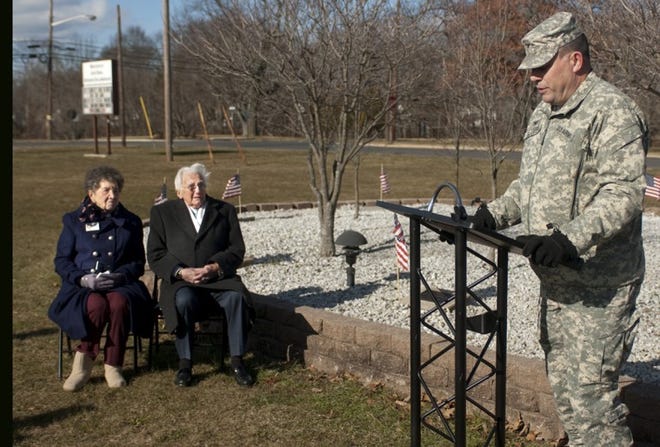 Cay Burns (left), Commander of the American Ex-Prisoners of War
Liberty Bell Chapter and Hainesport resident Steve Whitmore listen
to comments from Army Support Activity Fort Dix Commander Col.
Patrick Slowey (right), during a ceremony on Wednesday. Whitmore,
who has 68 years of military and federal service, was honored for
his caretaking of the POW memorial since it was built on Joint Base
McGuire-Dix-Lakehurst in 1985.