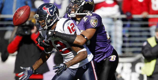 In this file photo, Houston Texans wide receiver Jacoby Jones fumbles the ball under pressure from Baltimore Ravens cornerback Cary Williams during the first half of a game on Jan. 15. In three of last weekend's four playoff games, the team with a big turnover margin won.