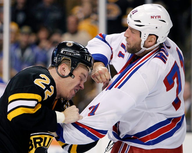 Shawn Thornton (left) and the Bruins fought Mike Rupp and the Rangers, but it wasn't enough in the overtime loss.