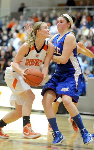 Hoover's Maddy Helterbran (left) pushes her way past Lake's McKenna Stephens in the 2nd quarter Saturday at Hoover.