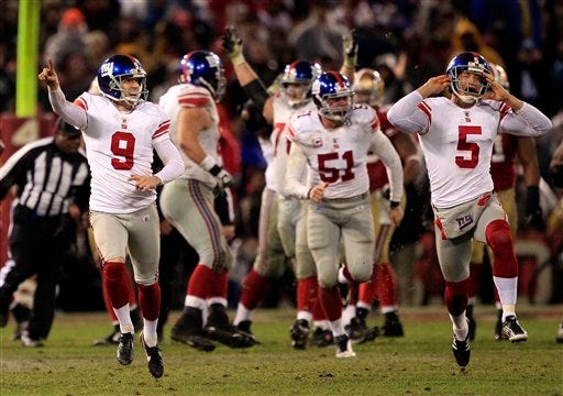 New York Giants kicker Lawrence Tynes (9) and punter Steve Weatherford (5) celebrate after Tynes kicked the game winning field goal during overtime of the NFC Championship NFL football game Sunday, Jan. 22, 2012, in San Francisco. The Giants won 20-17 to advance to Super Bowl XLVI, where they will play the New England Patriots.