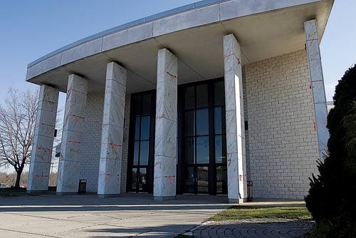 Photo by Tracy Klimek/New Jersey Herald - Orange hazard tape is seen around McNeice Auditorium’s pillars at Sussex Technical School in Sparta. The material holding the tiles together is deteriorating.
