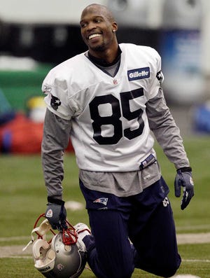 New England Patriots wide receiver Chad Ochocinco (85) smiles at team practice in Foxborough, Mass., Thursday, Jan. 26, 2012. The Patriots will face the New York Giants in the Super Bowl on Feb. 5 in Indianapolis. (AP Photo/Elise Amendola)