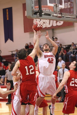 Monmouth College sophomore Cody Hillier goes up for a shot against Grinnell.