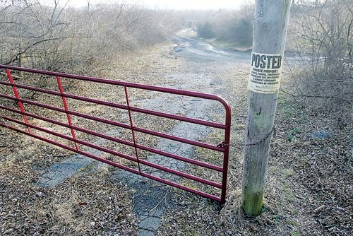 Photo by Daniel Freel/New Jersey Herald - A gate is seen blocking off access to Old Mine Road in Sandyston. A federal judge ordered the owners of a Sandyston farm, who erected the gate, to remove it.