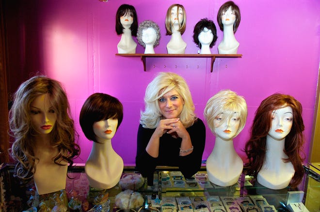 Karen Giugliano, owner of Masquerade Wig Salon in Gloucester . She opened the store in November.