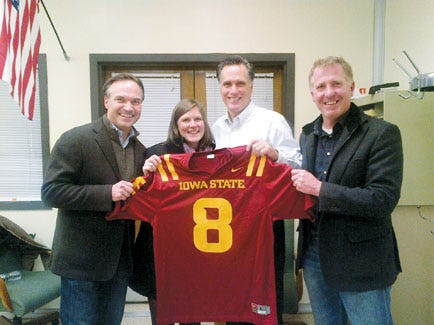 Gov. Mitt Romney’s Iowa Caucus campaign adviser and Newton resident Kent Lucken with Iowa campaign manager Sara Craig, Romney and Iowa campaign strategist David Kochel. The campaign team presented Romney with an Iowa State football jersey in honor of Romney’s Iowa Caucus win.* *While Romney was initially declared the victor by eight votes, Sen. Rick Santorum was later declared the winner of the Iowa caucus.