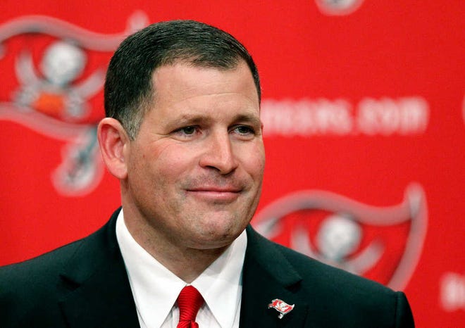 Tampa Bay Buccaneers new head coach Greg Schiano smiles as he introduced to reporters during an NFL football news conference on Friday, Jan. 27, 2012, in Tampa, Fla. (AP Photo/Chris O'Meara)