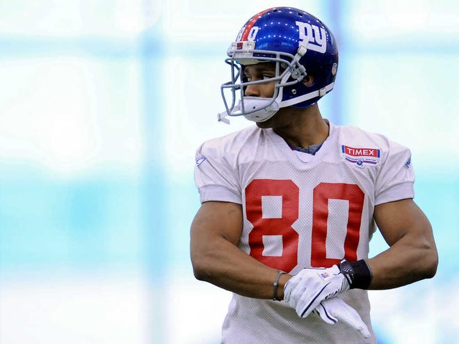 New York Giants wide receiver Victor Cruz looks on during NFL football practice, Friday, Jan. 27, 2012, in East Rutherford, N.J. The Giants play the New England Patriots in Super Bowl XLVI on Feb. 5 in Indianapolis. (AP Photo/Bill Kostroun)