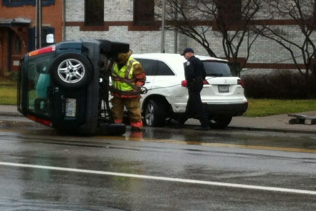 Police check out an overturned vehicle this morning on Third
Street in Beaver. No one was injured.