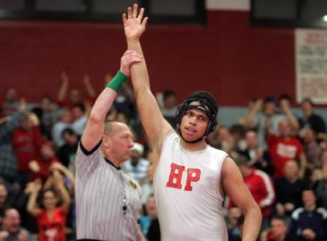 Photo by Daniel Freel/New Jersey Herald — High Point’s Chris Epperly has his hand raised after pinning Kittatinny’s Tom Smith in 40 seconds during thier 285-pound bout Thursday in Wantage.