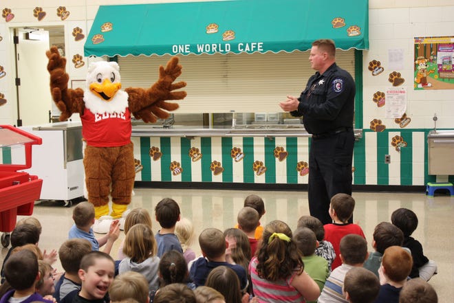 Officer Greg Lingenfelter introduces Eddie Eagle to the class.
The Canton Police Department provides first grade students at Westview Elementary School a visit from Eddie Eagle on Monday, Jan. 23. The Eddie Eagle GunSafe® Program teaches children in pre-K through third grade four important steps to take if they find a gun. These steps are presented by the program's mascot, Eddie Eagle®, in an easy-to-remember format consisting of the following simple rules: If you see a gun: STOP! Don't Touch. Leave the Area. Tell an Adult.