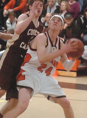 Wayland's Yannick Schaefer prepares to go up for a shot against Concord-Carlisle last night.